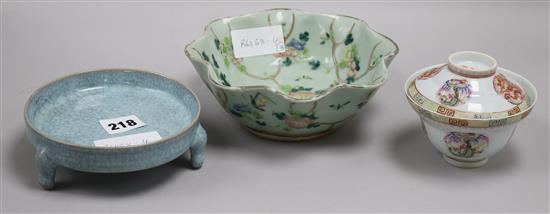 A Chinese celadon glazed dish, a Jun type tripod dish and a famille rose bowl and cover